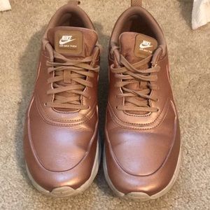 Rose gold nike thea